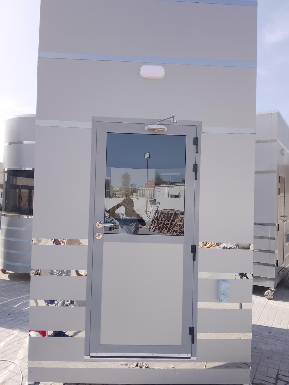 Aluminium entrance door with closer and bulkhead light