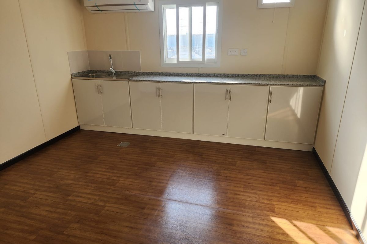 Pantry with granite counter and stainless sink