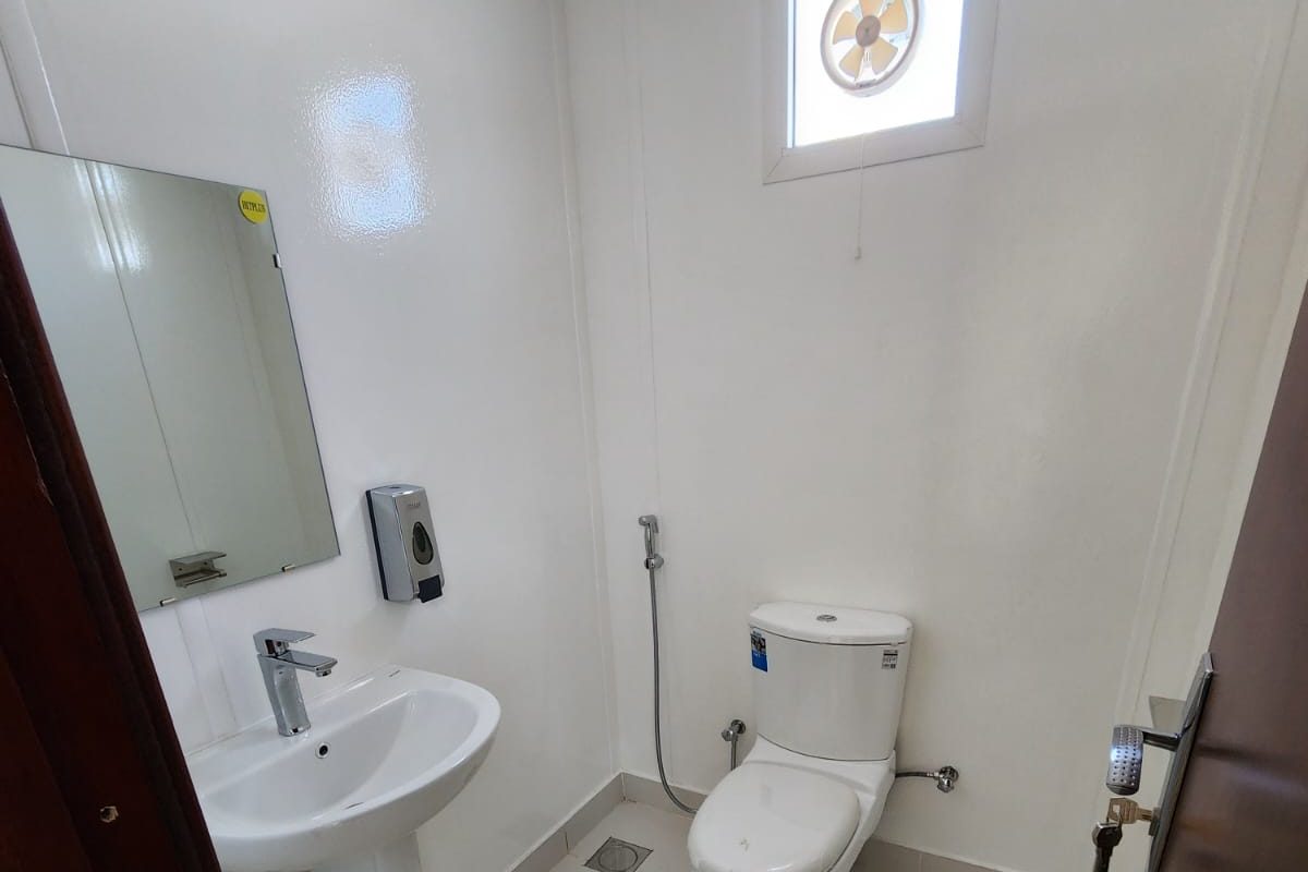 En-suite WC with wash basin and extract fan