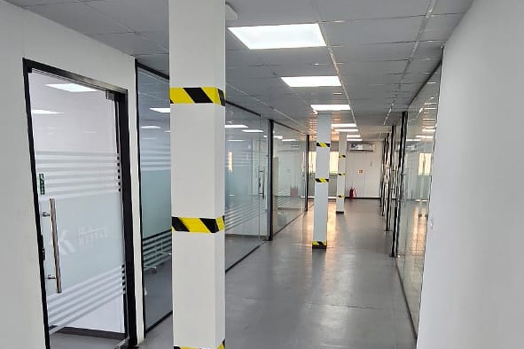 Glazed office fronts along the main corridor