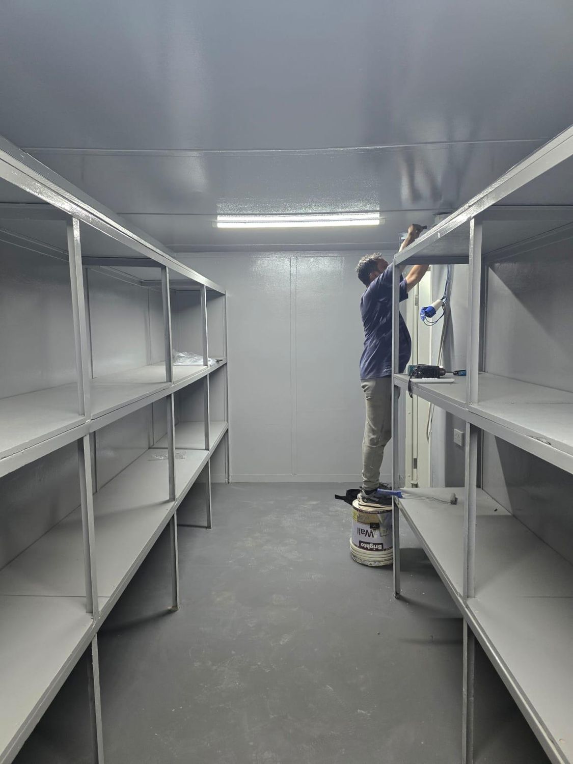 Shelving being installed